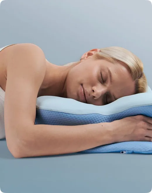 Person sleeping on their stomach on the pillow
